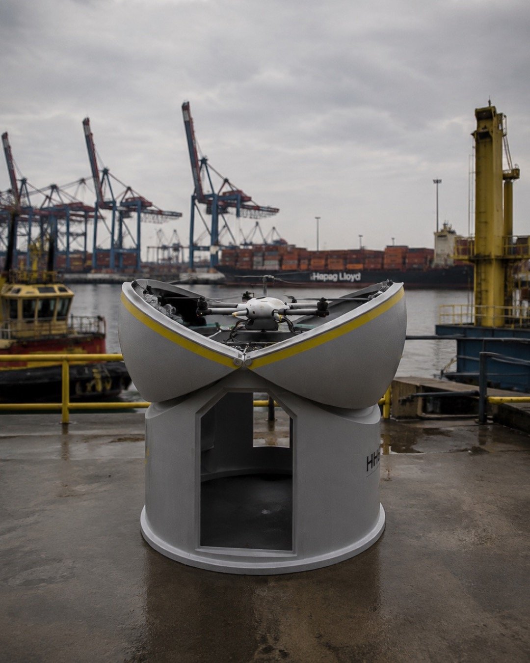 An HHLA AllSky automated drone station with its roof open at a container terminal